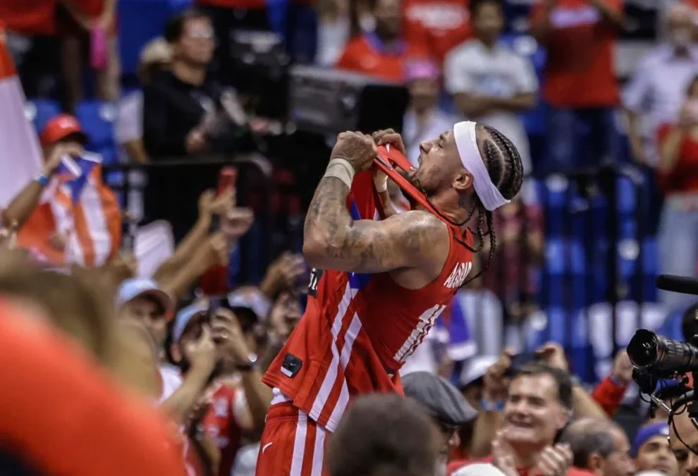 Jose Alvarado celebrated Puerto Rico’s Olympics-clinching win by jumping onto scorer’s table